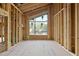 Spacious unfinished living room with large window offering natural light and customizable design at 1925 Hunting Ridge Rd, Raleigh, NC 27615