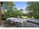 A pool under construction with a golf course view surrounded by mature trees in the background at 1925 Hunting Ridge Rd, Raleigh, NC 27615
