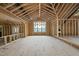 Room framed with exposed beams, featuring natural light, and new construction elements at 1925 Hunting Ridge Rd, Raleigh, NC 27615