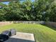 View of a spacious, well-maintained backyard with a lush lawn and a wooden fence at 201 Joe Gibson Dr, Gibsonville, NC 27249
