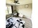 Bright Bedroom featuring a gray chair, a small white chair, and a black and white rug at 201 Joe Gibson Dr, Gibsonville, NC 27249