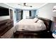 Relaxing bedroom with a fan, a crib, and wood-look flooring for added comfort at 201 Joe Gibson Dr, Gibsonville, NC 27249