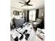 Cozy Bedroom featuring a gray dresser, comfortable chair, and stylish black and white rug at 201 Joe Gibson Dr, Gibsonville, NC 27249