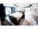 Stylish bedroom with a ceiling fan, a crib, and wood-look flooring for added comfort at 201 Joe Gibson Dr, Gibsonville, NC 27249