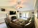 Spacious living room with vaulted ceilings, a comfortable couch, and a large TV at 201 Joe Gibson Dr, Gibsonville, NC 27249