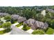 Beautiful brick home in quiet neighborhood featuring mature landscaping, attached garages, and paved driveway at 2012 Muirfield Ct, Elon, NC 27244
