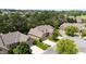 Charming brick home with an attached garage, mature landscaping, and a paved driveway in quiet neighborhood at 2012 Muirfield Ct, Elon, NC 27244