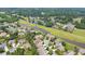 Aerial view highlighting the home's location near a peaceful waterway at 2012 Muirfield Ct, Elon, NC 27244