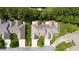 Stunning aerial view of property showcasing well-manicured lawns and beautiful landscaping at 2012 Muirfield Ct, Elon, NC 27244