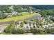 Aerial view displaying the community golf course and nearby pond at 2012 Muirfield Ct, Elon, NC 27244