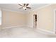 Spacious bedroom with neutral paint and a ceiling fan fixture at 2012 Muirfield Ct, Elon, NC 27244