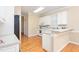 Efficient kitchen features bright white cabinets and laminate countertop, perfect for cooking at 2012 Muirfield Ct, Elon, NC 27244