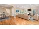Staged Living Room offers hardwood floors, fireplace and french doors leading to backyard at 2012 Muirfield Ct, Elon, NC 27244