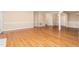 Spacious living room features hardwood floors and neutral paint, perfect for comfortable living at 2012 Muirfield Ct, Elon, NC 27244