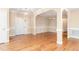 Bright living room with hardwood floors and traditional wainscotting at 2012 Muirfield Ct, Elon, NC 27244