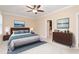 Main bedroom featuring ceiling fan, spacious design, en-suite bathroom, offering a private retreat at 2012 Muirfield Ct, Elon, NC 27244