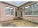 A cozy patio with brick accents, perfect for outdoor seating and enjoying the fresh air at 2012 Muirfield Ct, Elon, NC 27244