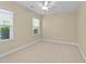 Cozy bedroom with carpet flooring, ceiling fan and natural light, perfect for relaxation and comfort at 2117 Crockett Ridge Rd, Fuquay Varina, NC 27526