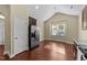 Kitchen nook featuring hardwood floors, stainless refrigerator, and lots of natural light at 2117 Crockett Ridge Rd, Fuquay Varina, NC 27526