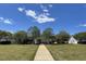 This picturesque community area features a well-manicured lawn and walkway leading to a gazebo at 2117 Crockett Ridge Rd, Fuquay Varina, NC 27526