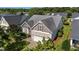 Well maintained exterior view of the home with manicured lawn and mature trees at 2117 Crockett Ridge Rd, Fuquay Varina, NC 27526