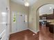 Bright foyer featuring wood floors, arched doorways, and an open view into the kitchen at 2117 Crockett Ridge Rd, Fuquay Varina, NC 27526