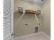 Functional laundry room with shelving for storage, ready for appliances, and conveniently located at 2117 Crockett Ridge Rd, Fuquay Varina, NC 27526