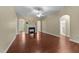 Bright living room featuring dark wood flooring, a fireplace, archways, and neutral walls at 2117 Crockett Ridge Rd, Fuquay Varina, NC 27526