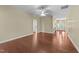 Spacious living room featuring dark wood flooring, archways, and neutral walls, ready for your personal touches at 2117 Crockett Ridge Rd, Fuquay Varina, NC 27526
