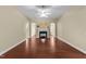 Open concept living room featuring dark wood flooring, a fireplace, and neutral walls at 2117 Crockett Ridge Rd, Fuquay Varina, NC 27526