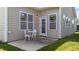 Cozy patio area with white outdoor table and chairs, perfect for relaxing outside at 2117 Crockett Ridge Rd, Fuquay Varina, NC 27526