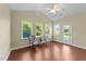 Sunroom features vaulted ceilings, dark floors, and large windows for natural light, perfect for relaxing at 2117 Crockett Ridge Rd, Fuquay Varina, NC 27526