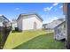 Backyard with green grass and a detached garage at 212 Aubey Ln, Wake Forest, NC 27587