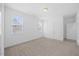 Bright bedroom with carpet floors, natural light, and a double door closet at 212 Aubey Ln, Wake Forest, NC 27587