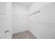 Walk-in closet with carpeted floor, white walls and wire shelving at 212 Aubey Ln, Wake Forest, NC 27587