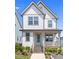Charming two-story home with welcoming front porch and well-maintained landscaping at 212 Aubey Ln, Wake Forest, NC 27587