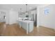 Modern kitchen featuring an island, stainless steel appliances, and ample cabinet space at 212 Aubey Ln, Wake Forest, NC 27587