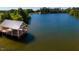 Picturesque lake view from a community gazebo, offering a tranquil space for relaxation and gatherings at 212 Aubey Ln, Wake Forest, NC 27587