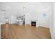 Spacious open-concept living room featuring a fireplace and hardwood floors at 212 Aubey Ln, Wake Forest, NC 27587