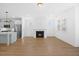 Open-concept living space with hardwood floors, cozy fireplace, and modern finishes at 212 Aubey Ln, Wake Forest, NC 27587