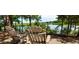 Relaxing outdoor seating area with views of the lake and surrounding nature, perfect for unwinding at 212 Aubey Ln, Wake Forest, NC 27587