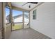 View of a screened-in porch with ceiling fan at 212 Aubey Ln, Wake Forest, NC 27587