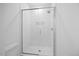 Glass-enclosed shower with tiled walls and floor with rainfall showerhead at 212 Aubey Ln, Wake Forest, NC 27587