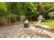 Secluded backyard with bamboo accents, patio and a fire pit at 218 Lafayette Rd, Raleigh, NC 27604