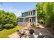 Charming backyard with patio, fire pit, and lush greenery at 218 Lafayette Rd, Raleigh, NC 27604