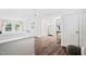 Spacious bedroom with hardwood floors, multiple closets, and a decorative window offering natural light at 218 Lafayette Rd, Raleigh, NC 27604