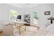 Bright home office featuring a modern desk, neutral decor and large windows at 218 Lafayette Rd, Raleigh, NC 27604