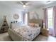 Charming bedroom with floral bedding, pink accents, and abundant natural light at 2212 Oxford Hills Dr, Raleigh, NC 27608