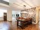 Open dining area with modern light fixture, stylish wallpaper, and seamless access to living area at 2212 Oxford Hills Dr, Raleigh, NC 27608