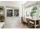 Bright home office space with large windows offering ample natural light and a practical workspace at 2212 Oxford Hills Dr, Raleigh, NC 27608